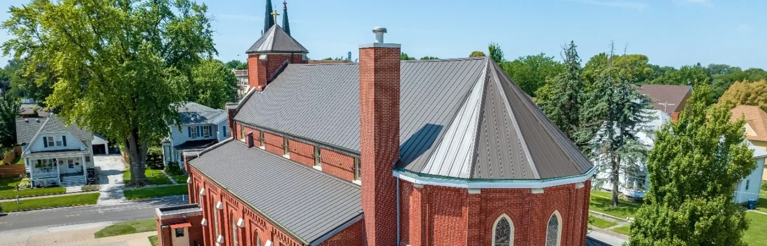 A church with new, beautiful metal roofing installed by Sunset Metal